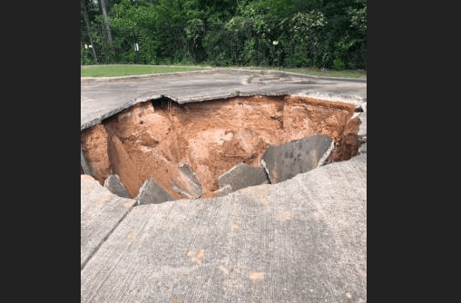 Large sinkhole opens in Oxford on Thursday and swallows a car
