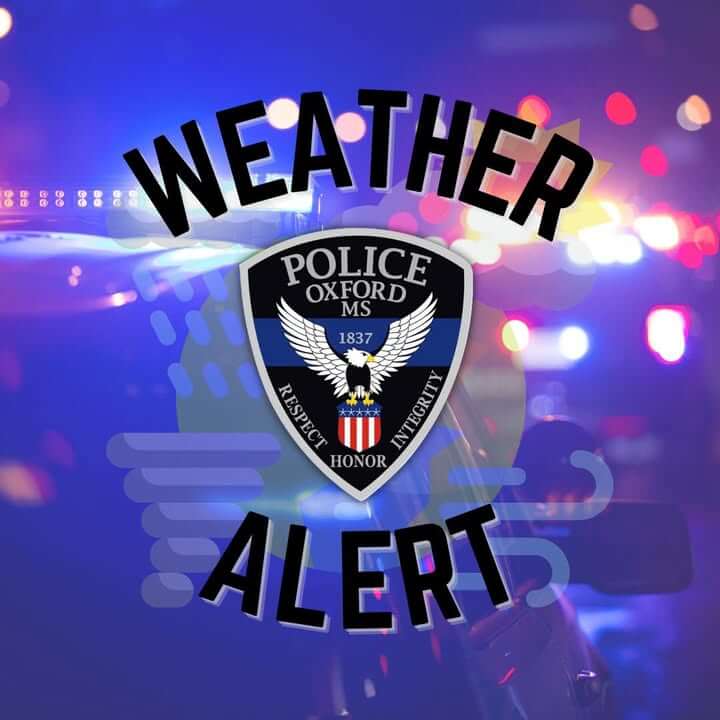 Officials urge residents to stay home as trees, power lines block roads