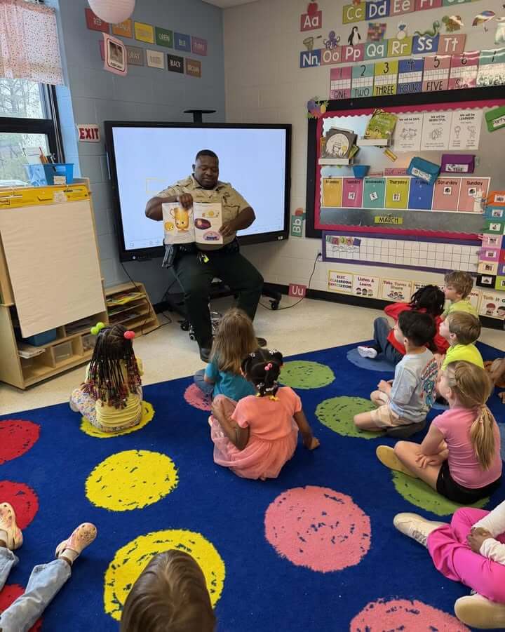 Deputy reads to students at Lee County child care center for Read Across America