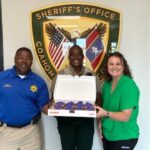 Clarksdale Rotary delivers purple pinkie donuts to sheriff's office to support polio eradication Clarksdale Rotary delivers purple pinkie donuts to sheriff's office to support polio eradication