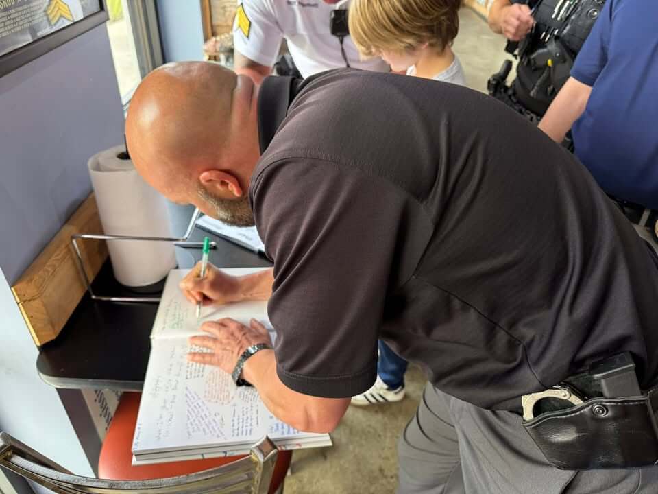 Ocean Springs police, mayor join Lost Pizza yearbook signing