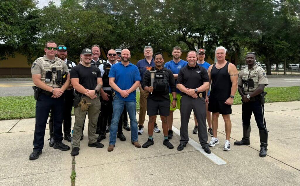 Ocean Springs officers carry Flame of Hope in Special Olympics Torch Run
