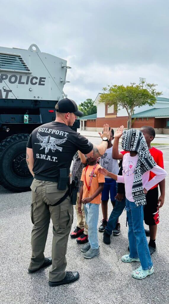 Gulfport police visit West Elementary; puppies steal show