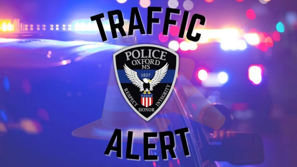 Construction crews stop traffic on Highway 7 near Office Park Drive