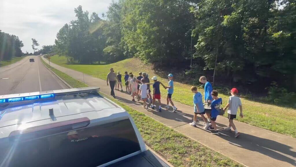 Uphill sandbag carries kick off week two of Camp C.O.P.S.