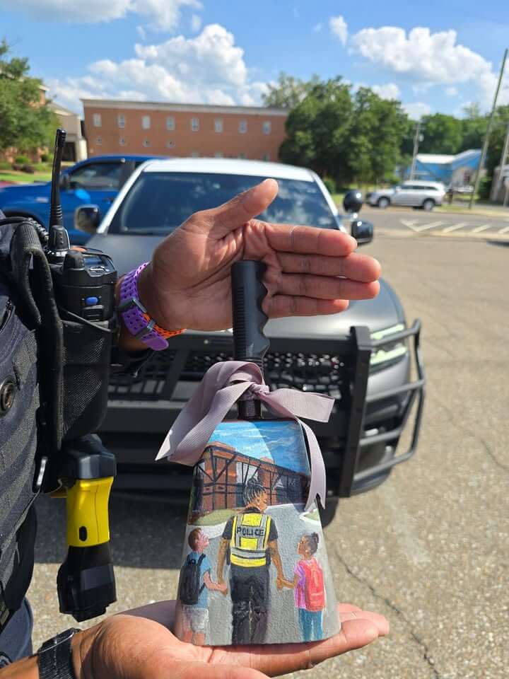 Starkville church presents cowbell to police corporal
