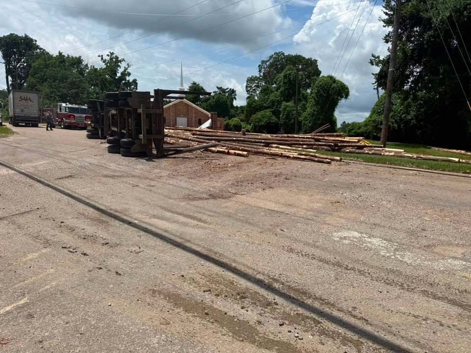 Vicksburg police manage scene after log truck overturns