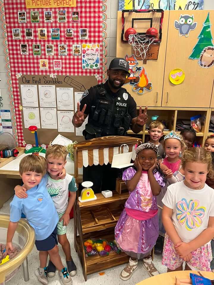 Officer Lee assembles classroom furniture, earns class praise