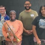 Ingomar Band receives encouragement from musician Zeke Listewbee bd9d2922e2bd41813922973a